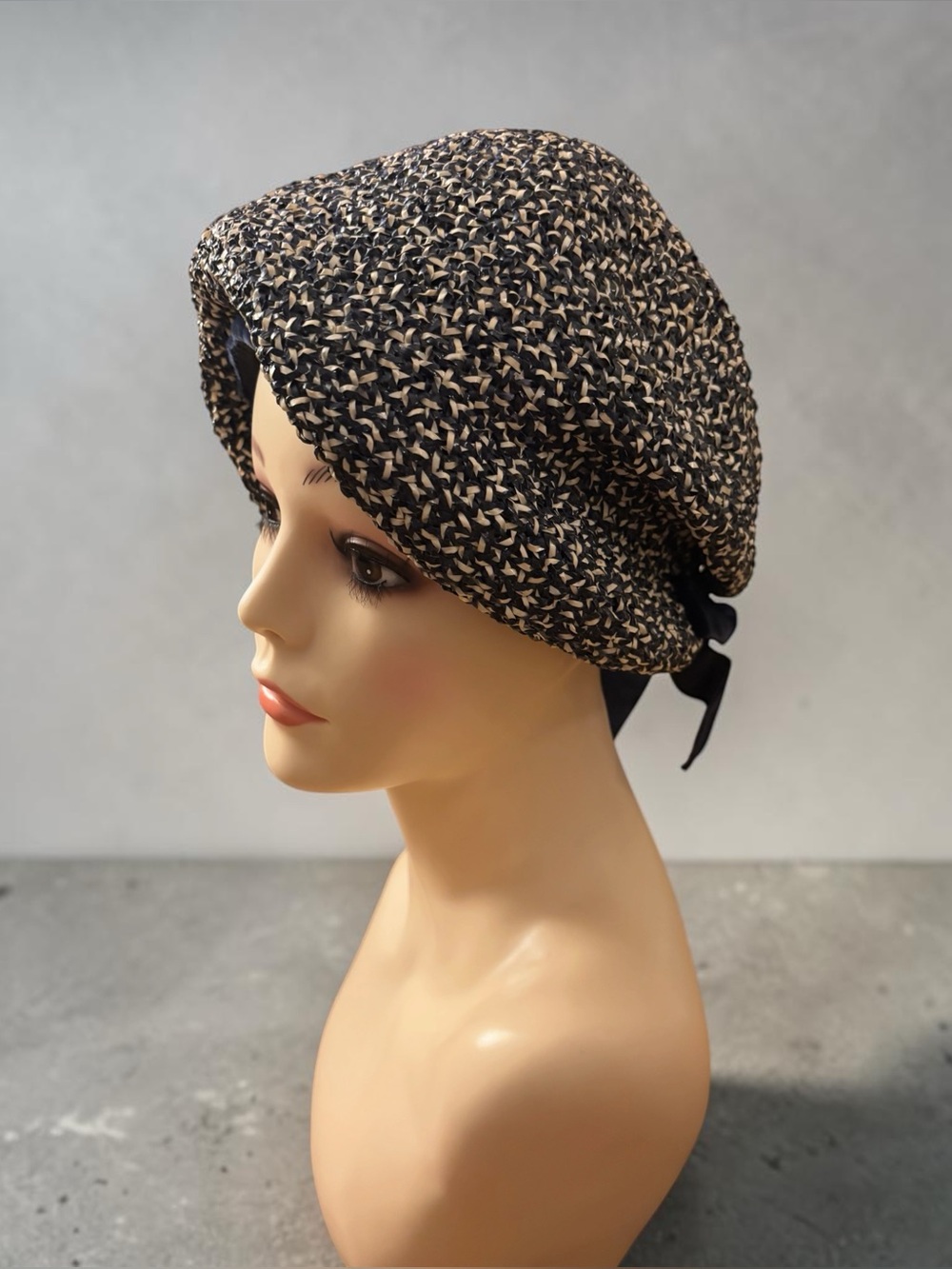 Vintage 1960s Ranleigh mod bubble straw hat, with black, cream, and brown tones.